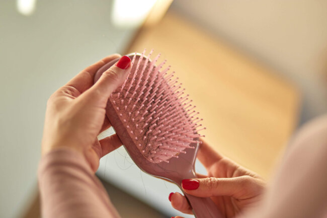 Problem hair loss concept, losing hair on hairbrush